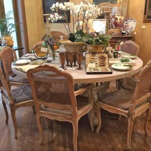 dining room set with table and chairs with dishes