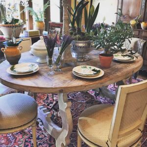 dining table with chairs and decorative items on top
