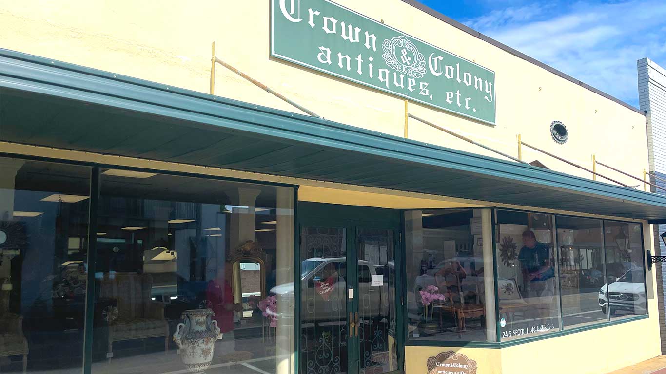 Exterior building photograph of Crown and Colony Antiques in downtown Fairhope, Alabama